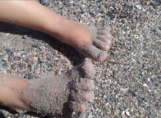 Feet in the sand. Photo © Karethe Linaae